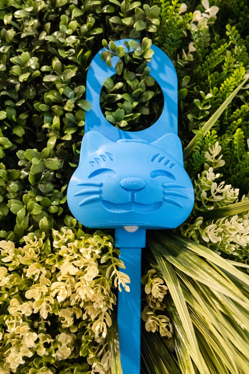 A cyan blue Sidewinder smart cat toy.