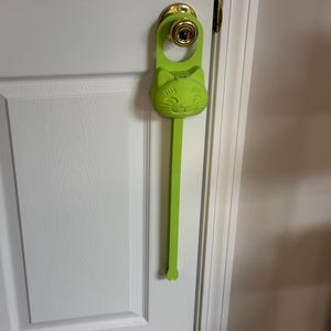 A brat green Sidewinder smart cat toy.