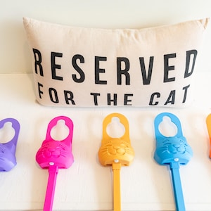 Various colors of the Sidewinder smart cat toy.