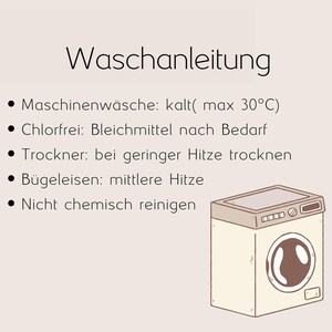 May include: An illustration of a washing machine with the text "Waschanleitung" above. The text provides laundry instructions, including machine wash cold (max 30&deg;C), chlorine-free bleach as needed, tumble dry low heat, iron medium heat, and do not dry clean.