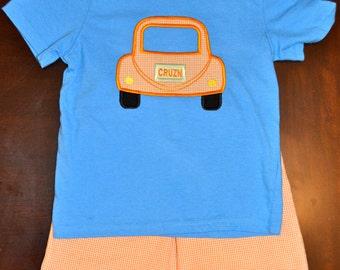 Boys gingham shorts with applique top.