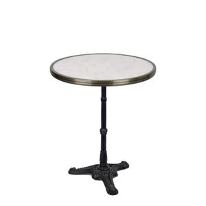 May include: A small, round bistro table with a white marble top and a brass-colored edge. The table has a black, ornate cast iron base and a single central support. The table is approximately 24 inches in diameter.