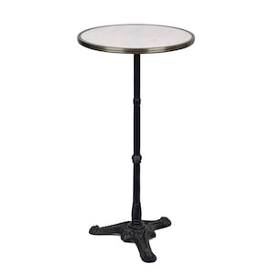 May include: A black bistro table with a white marble top and a three-legged base.