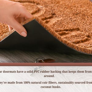 May include: A brown coir doormat with a black rubber backing is shown, with a hand lifting a corner to reveal the underside. The doormat is made from natural coir fibers.