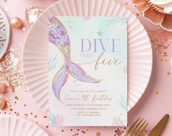 May include: A mermaid-themed birthday invitation with the text "Dive into Five." The invitation features a watercolor mermaid tail in shades of purple, pink, and gold. The invitation is on a pink plate, surrounded by cupcakes and decorative elements.
