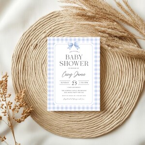 May include: A blue and white gingham baby shower invitation with a blue bow. The invitation reads "Join us for a Baby Shower in honor of Casey James, Sunday, Oct 25, 2 to 5pm, Carey Residence, The Jumping Castle Melbourne, xxx Road, Party for you. RSVP to Jenny by Sep 15th. Designed and Designed and Created by Jenn."