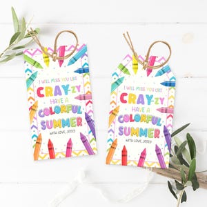 May include: Two gift tags with a colourful crayon design. The tags have a white background with text that reads "I will miss you like CRAY-ZY, have a COLORFUL SUMMER, with love, Jessy."