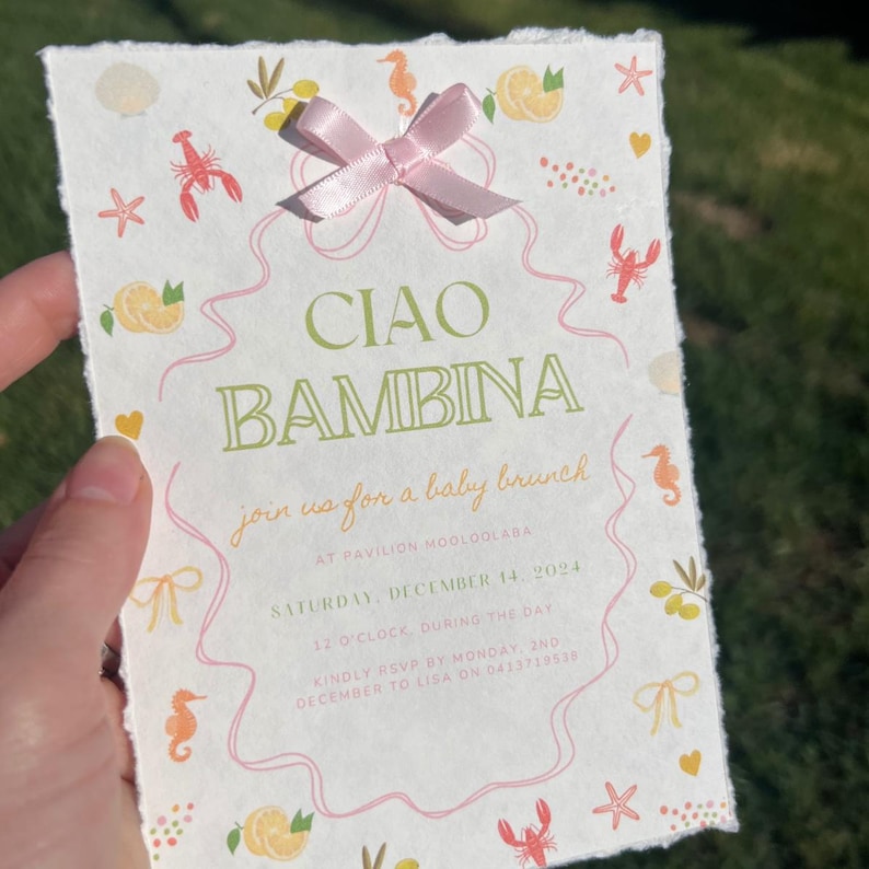 May include: A pink and white baby shower invitation with a green and white title that says "Ciao Bambina". The invitation is decorated with illustrations of lemons, seahorses, and starfish. The text on the invitation reads "Join us for a baby brunch at Pavilion Mooloolaba, Saturday, December 14, 2024, 12 o'clock, during the day. Kindly RSVP by Monday, 2nd December to Lisa on 0413718535."