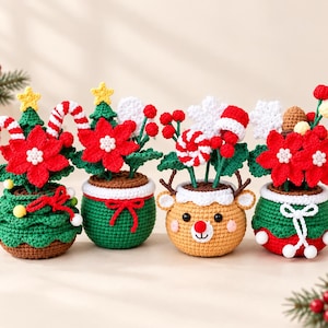 May include: Four crocheted potted plants featuring holiday themes. The pots are shaped like a Christmas tree, a green bowl, a reindeer face, and a red and green base. Each plant is decorated with red poinsettias, candy canes, and berries.
