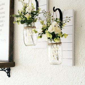 Set of Two Hanging Mason Jar Sconces with lights and greens-roses. Chic Farmhouse Wall Decor ..Painted Mason Jars with Faux Shiplap