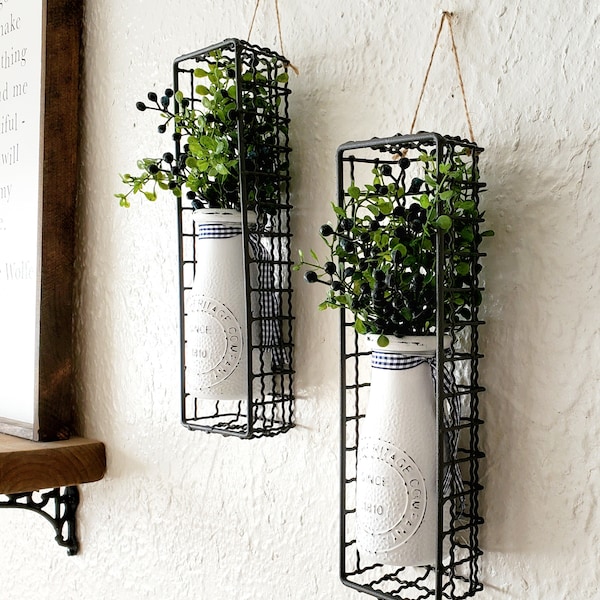 Chic Farmhouse Kitchen Wall Sconces. 2 Hanging Vintage Milk Bottles in Wire Baskets with bkack/blueberries and greens. Country Dining Decor