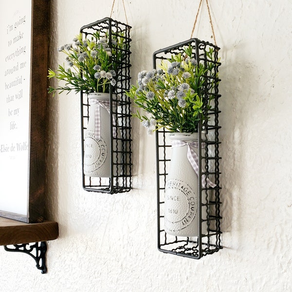 Chic Farmhouse Kitchen Wall Sconces. 2 Hanging Gray Vintage Milk Bottles in Wire Baskets with greens/baby's breath. Country Farmhouse Decor