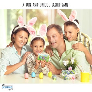 May include: A family of four, including two children, are playing an Easter game. The children are wearing bunny ears headbands. The girl is holding a card with a picture of Easter eggs. There are several colorful Easter eggs on the table in front of them.