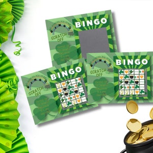 May include: Three green and gold St. Patrick's Day Bingo cards with a scratch-off feature. The cards have a rainbow, shamrocks, and a pot of gold. The text on the cards reads "St. Patrick's Day Bingo Scratch Off".