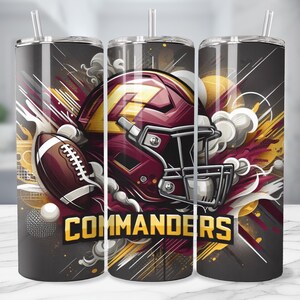 May include: A stainless steel tumbler with a graphic design featuring a football helmet, a football, and the word "COMMANDERS". The design is in shades of red, yellow, and black.