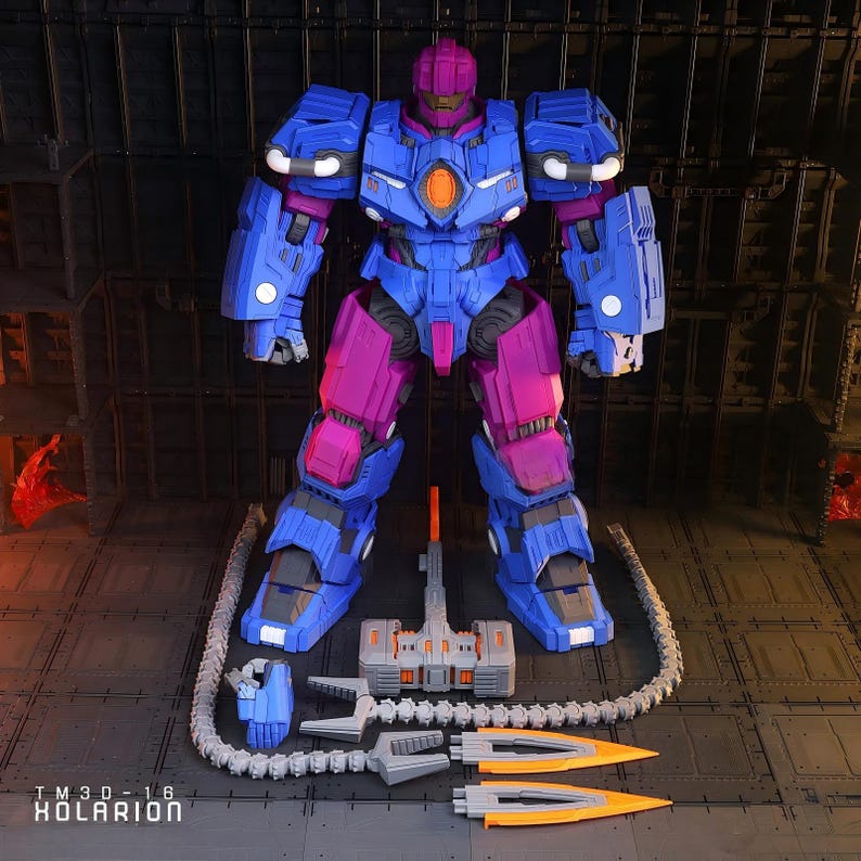 May include: A detailed robot action figure in blue and magenta armour, with multiple accessories. The figure has a complex design, with a hammer, cannon, and other weapon components. The text "TM 3D - 16 KOLARION" is visible at the bottom of the image.