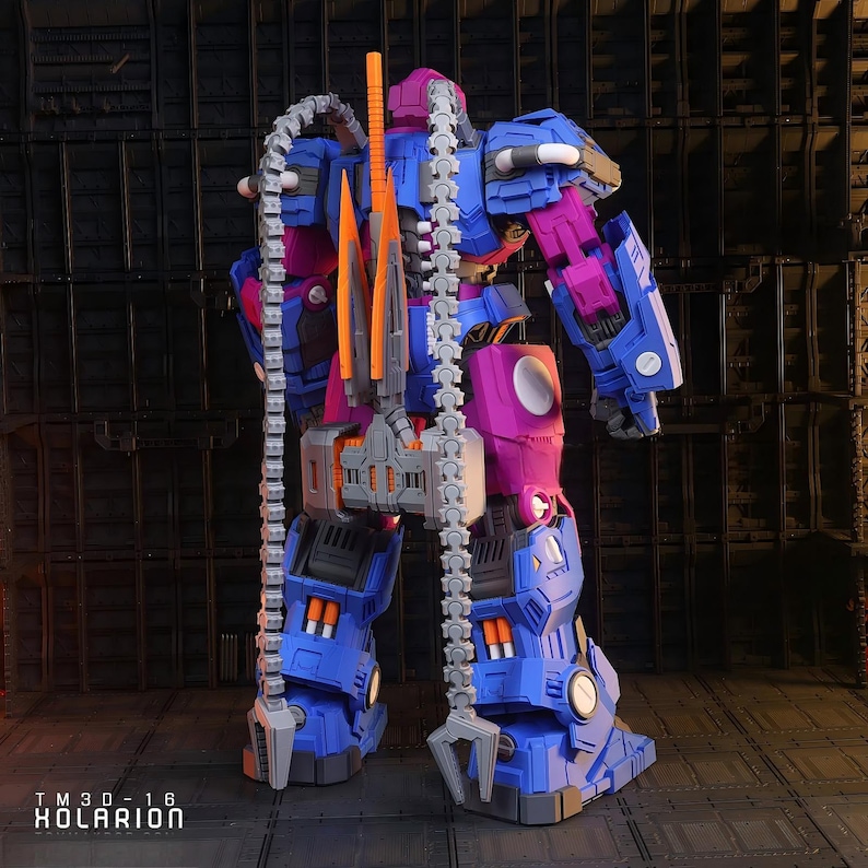 May include: A detailed robot toy in blue, purple, orange, and grey. The toy features a complex design with articulated joints and attachments, including a chain weapon. The text "TM30-16 KOLARION" is visible at the bottom of the image.