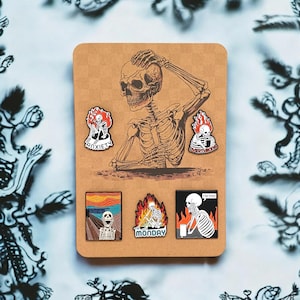 Pin Badge Brooches - Five Skeleton Brooches - Enamel pin badge brooch mounted on brown card - wrapped in a cellophane gift bag