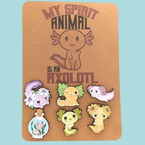 Axolotl-broches met zes badges - axolotls-pinbadges - badgebroches op bruine gedrukte kaart gewikkeld in een cellofaanzakje Axolotols - Axolotils -