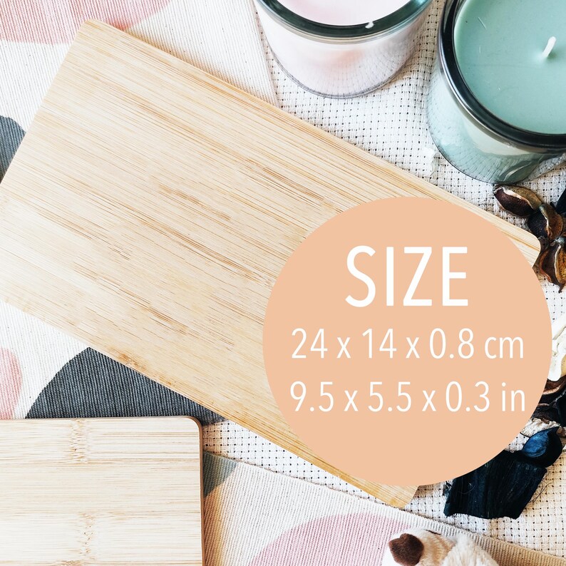 May include: A natural bamboo cutting board with a light wood grain. The board is rectangular and measures 9.5 x 5.5 x 0.3 inches.