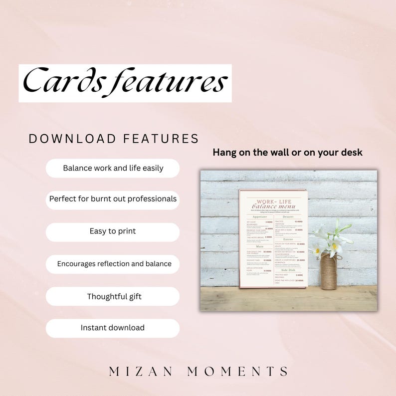 May include: A printable work-life balance menu card with a pink and white color scheme. The card features a list of activities to help balance work and life. The card is framed and hanging on a wall with a vase of white flowers in the foreground.