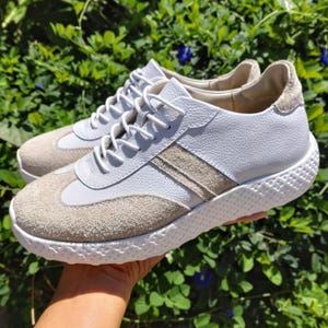 Genuine leather suede sneakers for men and women. Original sneakers handmade by artisans. Stylish two-tone suede sneakers.