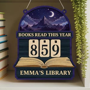 May include: A wooden sign with a night sky mountain scene, the text "BOOKS READ THIS YEAR" and the number "859". The sign also features an open book design and the text "EMMA'S LIBRARY".