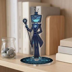 May include: Acrylic figure of a cartoon character with a TV screen head, wearing a dark blue suit and holding a staff with a triangle on top. The figure stands on a round base with a circuit board design and wireless symbols. The figure is approximately 6 inches tall.