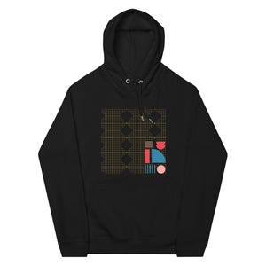 May include: Black hooded sweatshirt with a geometric design in yellow, red, blue, and pink. The design features a grid of small dots and abstract shapes.