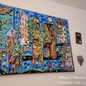 May include: A colorful mixed media painting depicting a town scene with houses, trees, and people. The painting is done in a vibrant style with a blue background and features a variety of textures and materials.