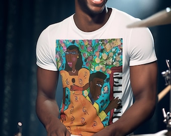 May include: White t-shirt featuring a colorful illustration of two people, one holding a microphone and the other at a piano. The shirt is worn by a person playing the drums, smiling broadly. The background is dark.
