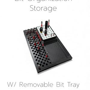 May include: Black bit organization and storage tray with a removable bit tray. The tray has a honeycomb pattern and holds various bits with red and silver accents. The text "Bit Organization Storage" and "W/ Removable Bit Tray" are displayed.