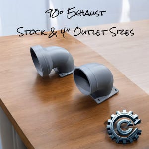 May include: Two gray 90-degree exhaust pipes with stock and 4-inch outlet sizes. The pipes are on a wooden surface.