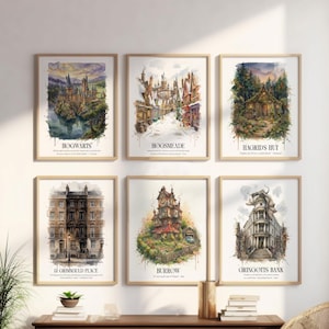 May include: A set of six framed watercolor art prints featuring iconic locations from the Harry Potter series, including Hogwarts, Hogsmeade, Hagrid's Hut, 12 Grimmauld Place, The Burrow, and Gringotts Bank, each labeled with its respective name.