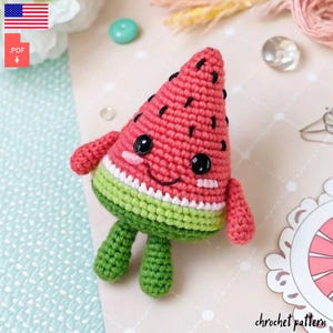 May include: Crochet pattern for a watermelon amigurumi toy. The toy is red, green and white and has a smiling face. The pattern is available as a PDF download.