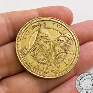 MONEDA RICHEH de Witch Hat Atelier. Coleccionable