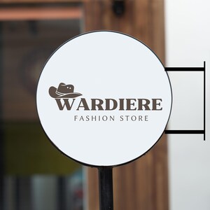 May include: A white round sign with a brown cowboy hat logo and the text "WARDIERE FASHION STORE".
