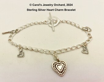 Handmade Sterling Silver Charm Bracelet - All components sterling silver - chain, charms, and clasp. Heart theme for a loving gift to give.