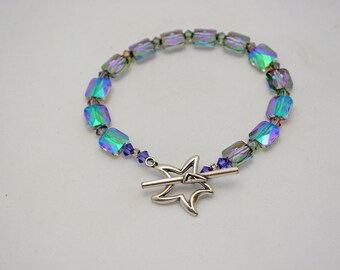 Reserved for Lisa. Swarovski Bracelet in Crystal Paradise Shine w/ Pewter Star Clasp. Reflects lavender, green, & pink. Unique jewelry.