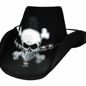 May include: Black cowboy hat featuring a white skull and crossbones design. The hat has a wide brim and a tall crown.