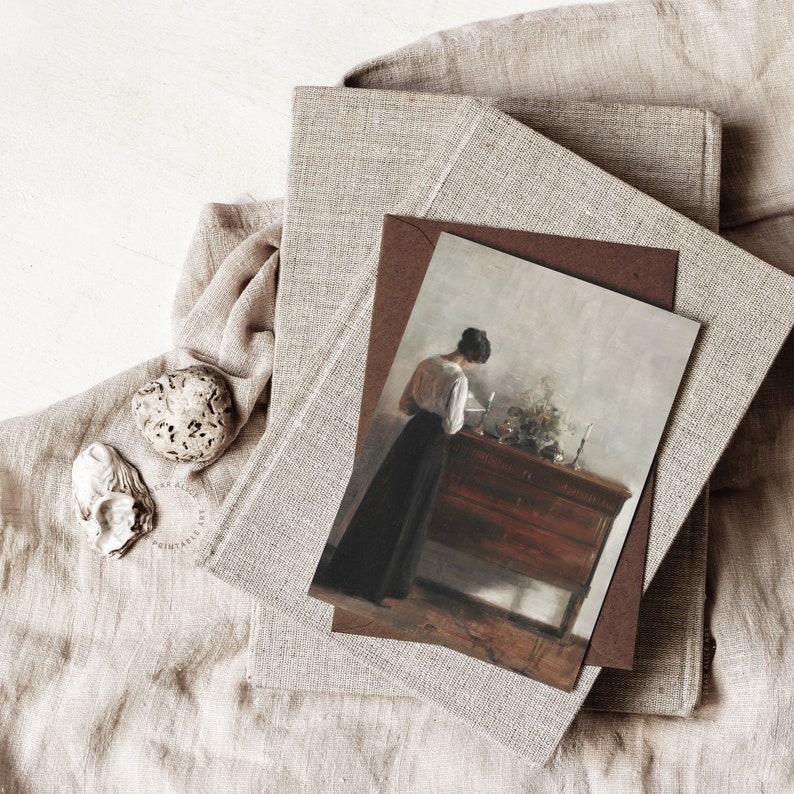 Antique Woman Portrait Painting reproduced on a Greeting Card with a dark brown enveloppe, on top of a pile of books with linen covers | Dear Alice Printable Art