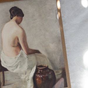 Vintage Nude Portrait of a young woman washing herself near an antique terra-cotta large jar, framed and laid on a white linen tablecloth under the sun. | Dear Alice Printable Art