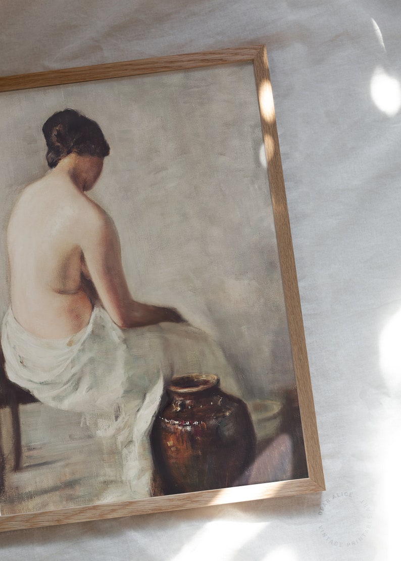 Vintage Nude Portrait of a young woman washing herself near an antique terra-cotta large jar, framed and laid on a white linen tablecloth under the sun. | Dear Alice Printable Art