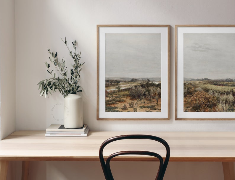 Set of Two Printable Farmhouse Wall Art featuring a landscape in muted earthy tones. Downloadable pair of landscape prints hung on the wall of a neutral and calm farmhouse office decor. | Dear Alice Art