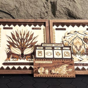 Monster Hunter wood wall art featuring handcrafted layered wooden plaques showcasing Nergigante and Barroth in intricate 3D design. The solid wood front and basswood backing create a beautifully detailed, high-quality finish. These unique wall pieces are perfect for Monster Hunter fans and collectors who want to add a touch of the iconic game to their living space. With carefully pieced together wood layers, the craftsmanship is unmatched