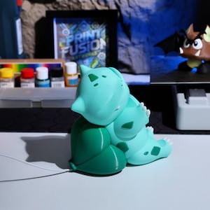 Fast charging phone holder with an eco-friendly design, perfect for fans of quirky phone accessories and nature-inspired creatures. Ideal gift for gamers, collectors, and anyone who loves fun and practical home decor.