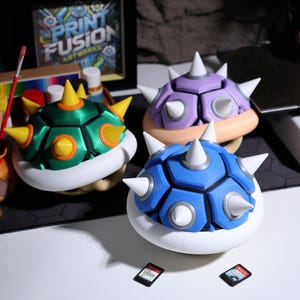Mario turtle shell-inspired case game holder durable protective Switch cartridge box ideal Christmas gift Nintendo fans New Year gift for gamers Mario collectible gaming decor retro game storage game week gift ideas.