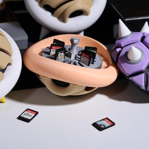 Mario-inspired Turtle Shell Switch cartridge storage box fun game storage organizer Nintendo Switch fans collectors item Christmas New Year Thanksgiving gifts for gamers nostalgic game accessory sturdy durable case decorative collectible.