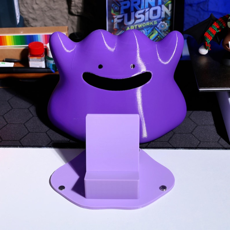 Unique 3D printed tissue holder in the shape of a monster, adding fun and charm to any space. The magnetic base ensures it stays securely in place, making it an excellent addition to any desk, home, or office setup.