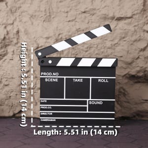 Miniature director’s film set displayed on a desk, illustrating how well it complements a creative workspace. The 3D printed chair and clapperboard add a cinematic element to your office, making it a perfect accessory for filmmakers, writers, producers, and content creators. A great holiday or graduation gift for movie lovers, this set brings the essence of the film industry to life in a compact, decorative format. Ideal for fans of behind-the-scenes storytelling and Hollywood culture.